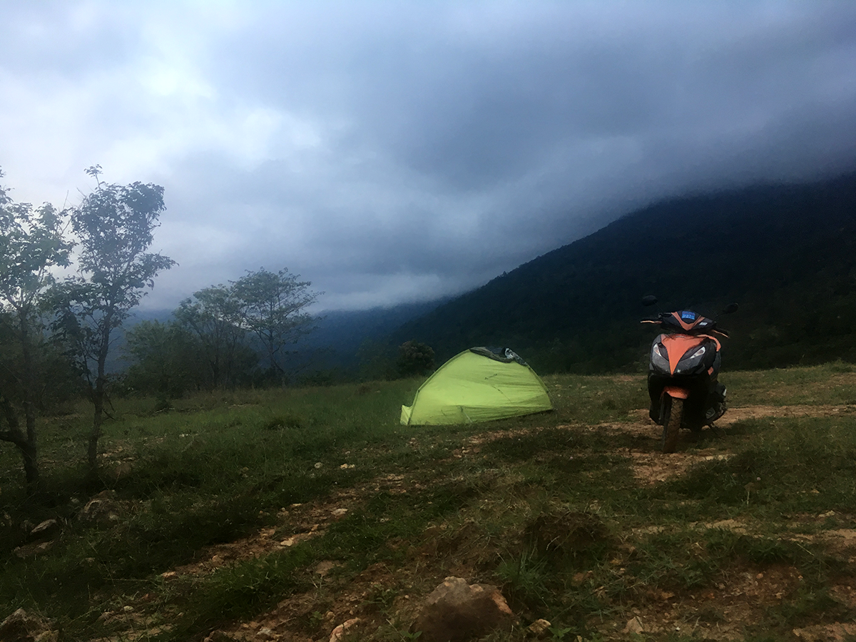 Scooter and tent at Bokor