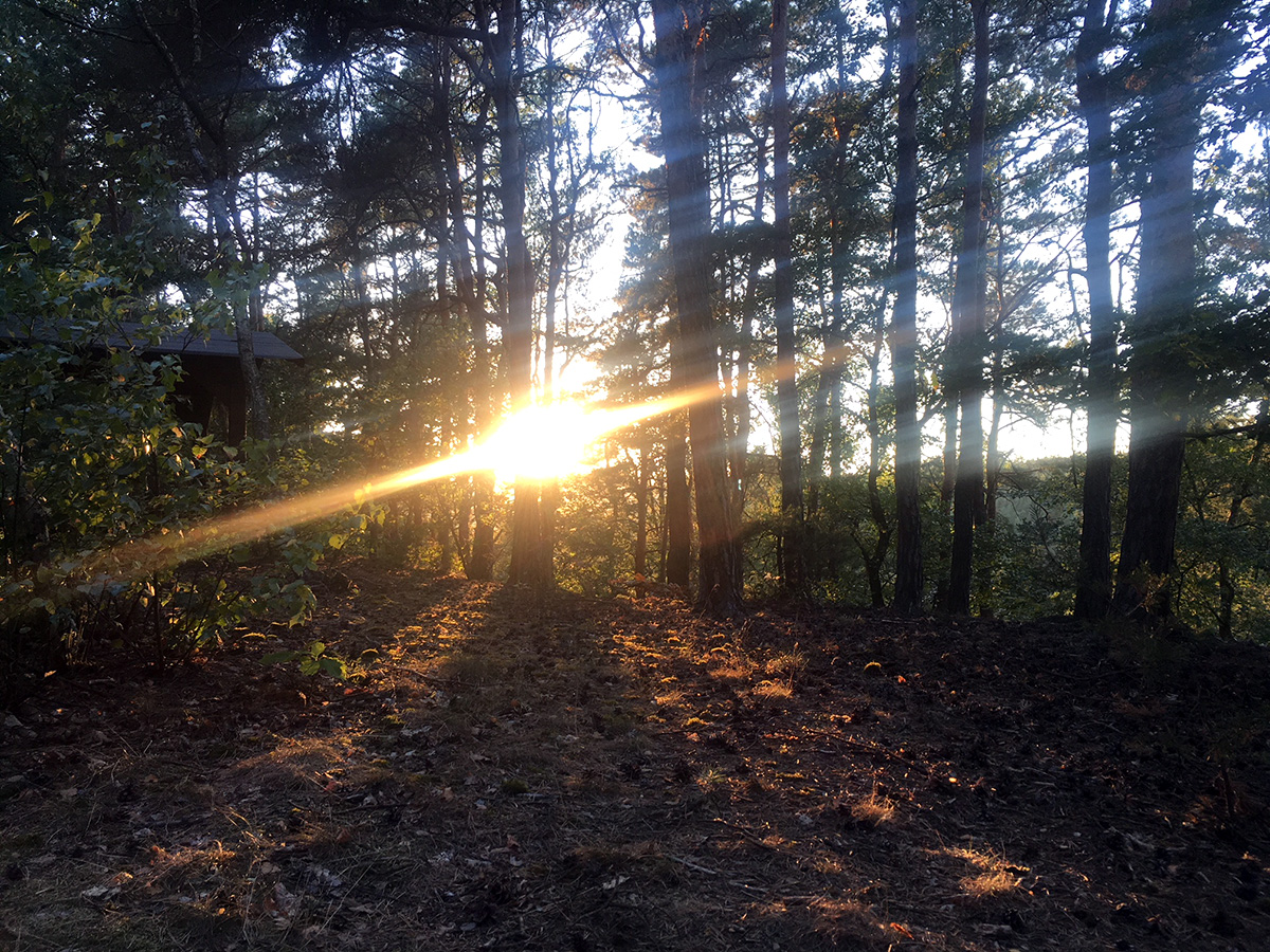 Magical sun setting behind a mountain in Decin