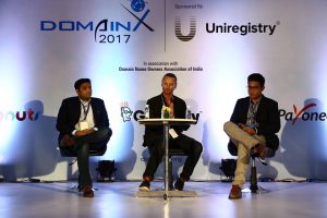 Sea Ansley (Mother.Domains) moderating a panel at DomainX 2017